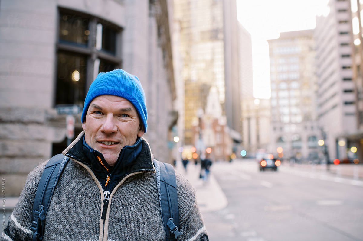 Middle aged man wearing coat and blue hat in Boston