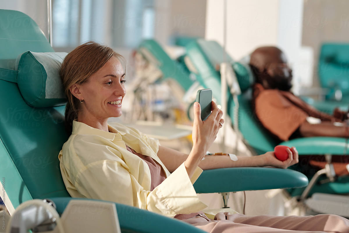 Cheerful Blood Donor Having Video Call