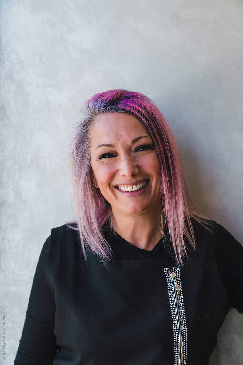 Portrait of a Smiling Woman with Pink Hair