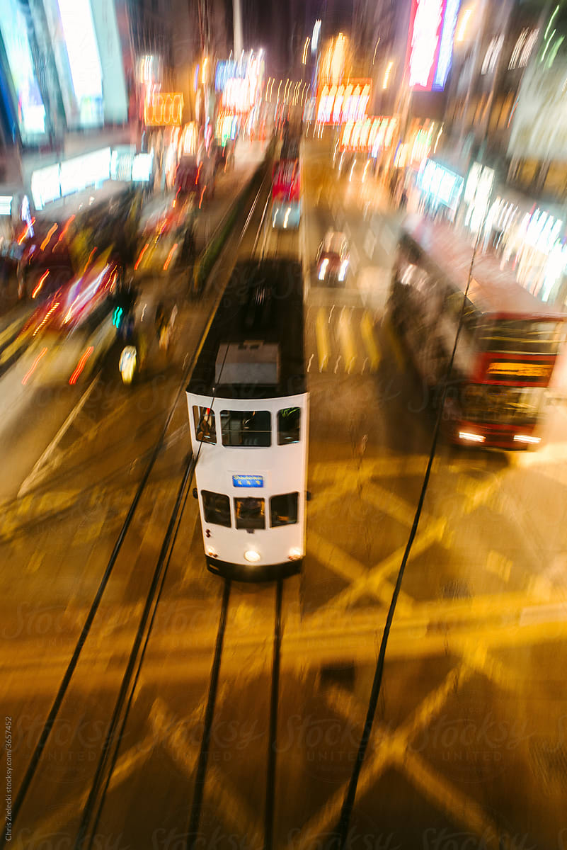 Tramway on railroad in evening city