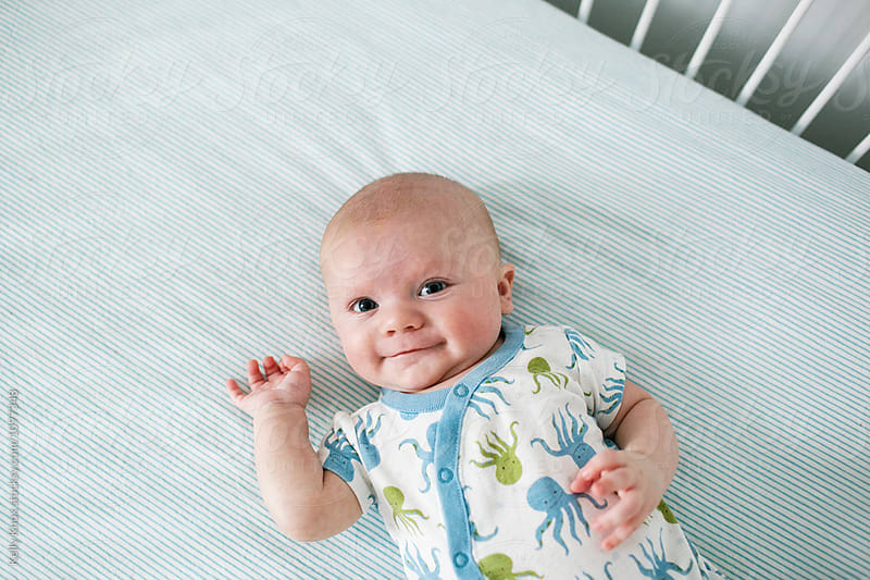 happy baby in a crib