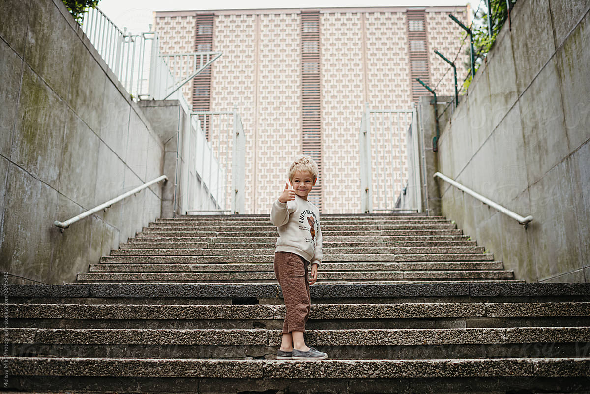 Little boy on a staircase outdoors