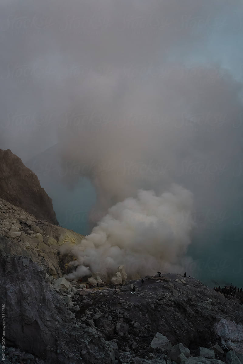 Sulfuric Smoke Rising From a Volcanic Lake at Dusk