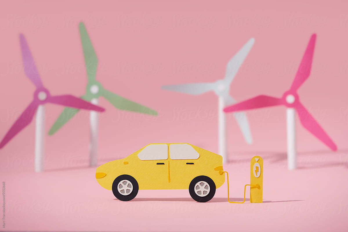 Car charging on the background of a windmills