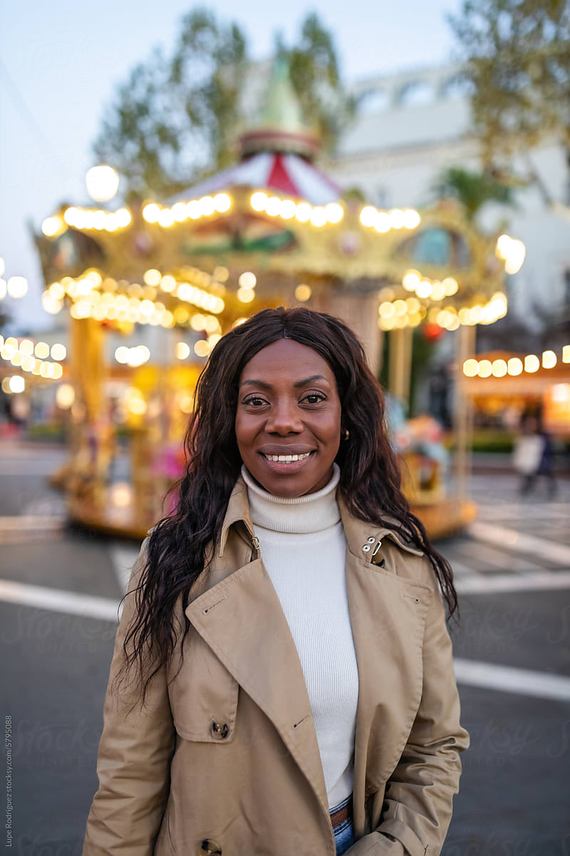 portrait of black woman at a city fair