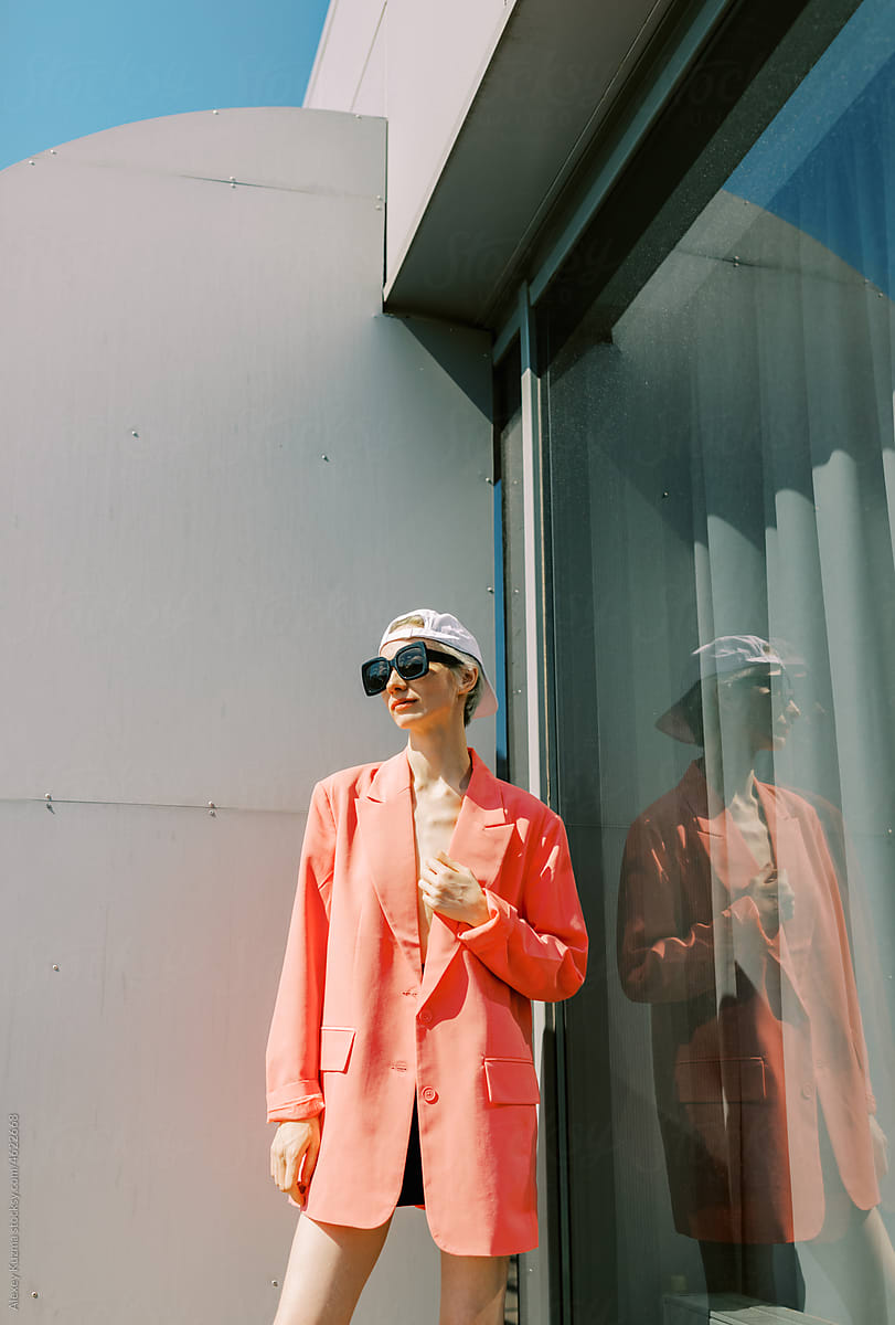 woman with bright pink jacket outdoors