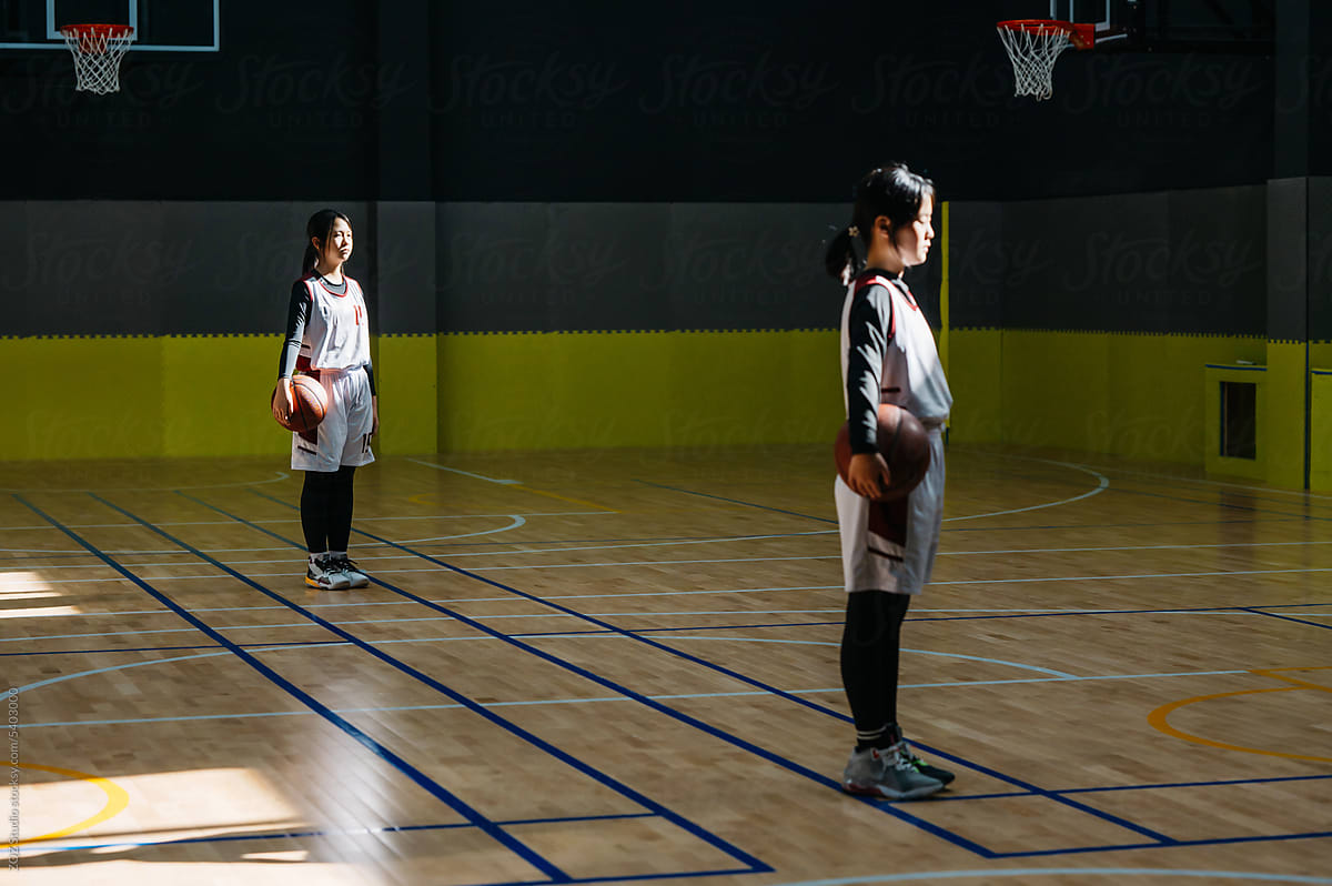 Portrait of basketball girls standing in a gym