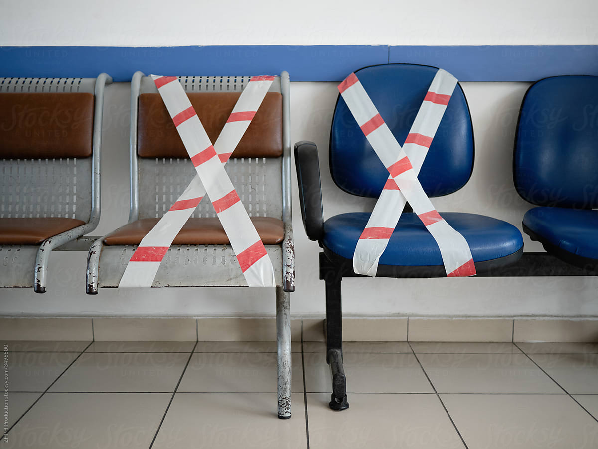 Chairs crossed with caution tape in times of pandemic travel