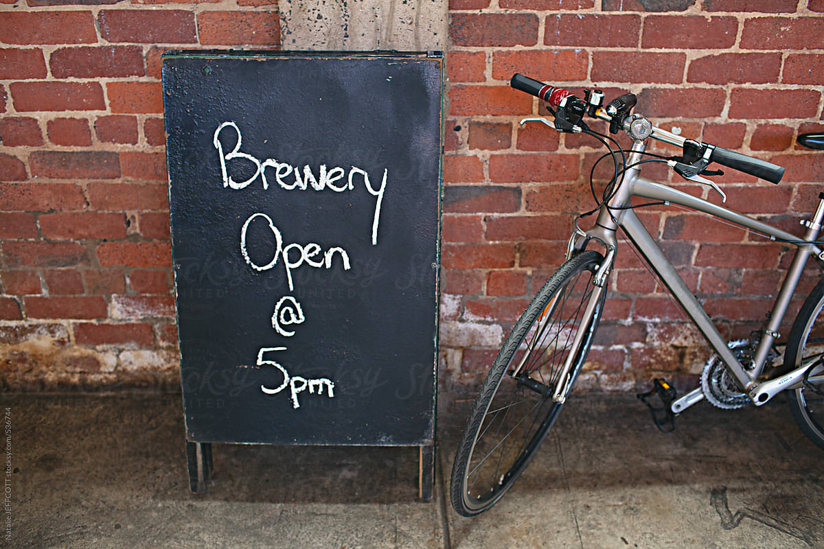 chalkboard sign at a micro brewery with bicycle
