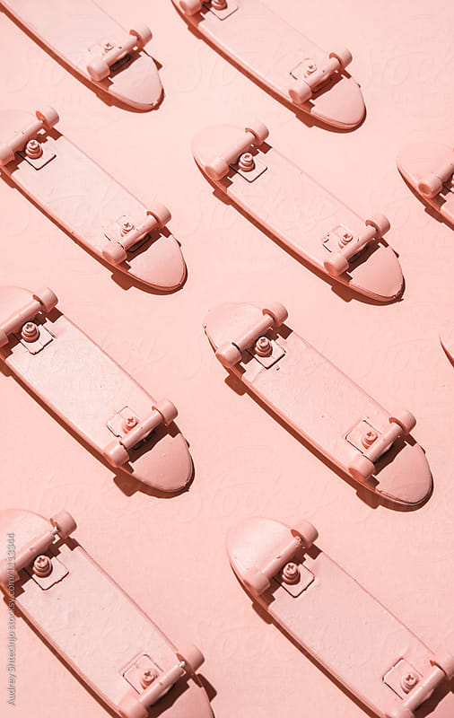 Pink skateboards on pink background