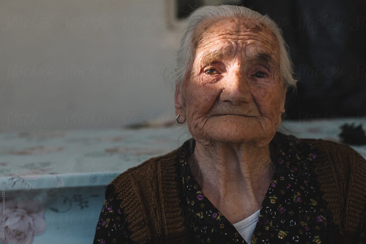 Old woman with tiers in eyes
