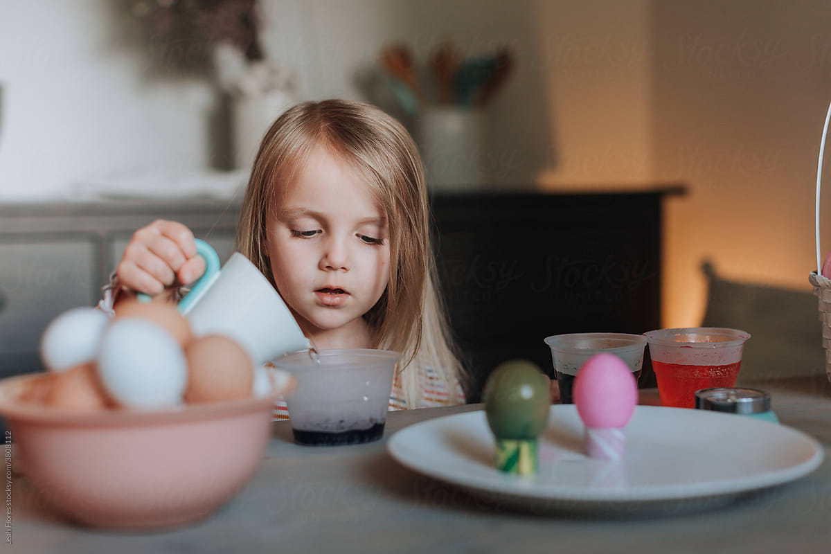 Young Girl Adding Water to Easter Egg Dye