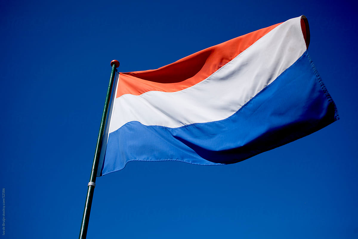 A Waving Dutch Flag In A Clear Blue Sky By Stocksy Contributor Ivo De Bruijn Stocksy