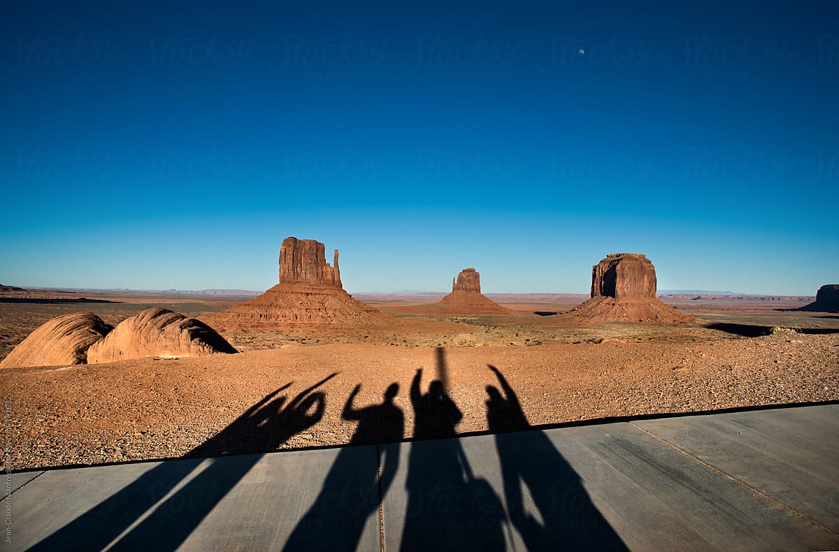 Shadow of 5 guys who went crazy in front of the panorama of the monument valley