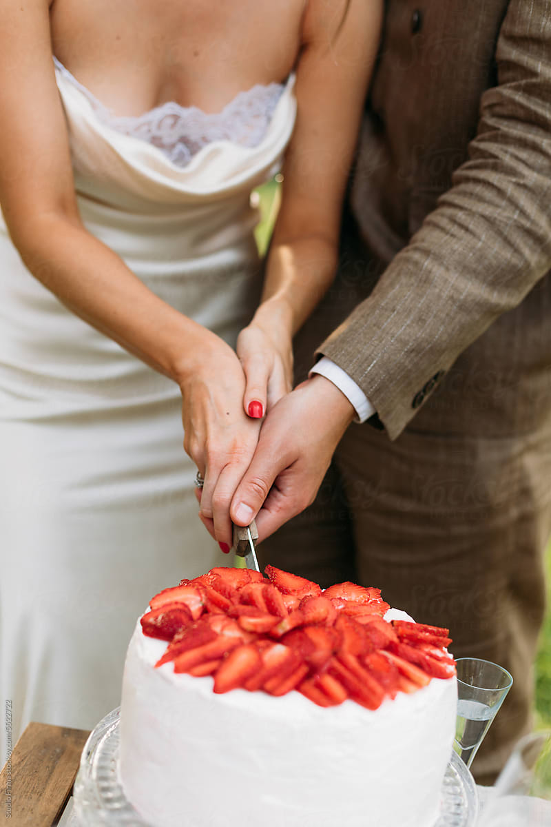 Couple Cutting Cake at Their Wedding