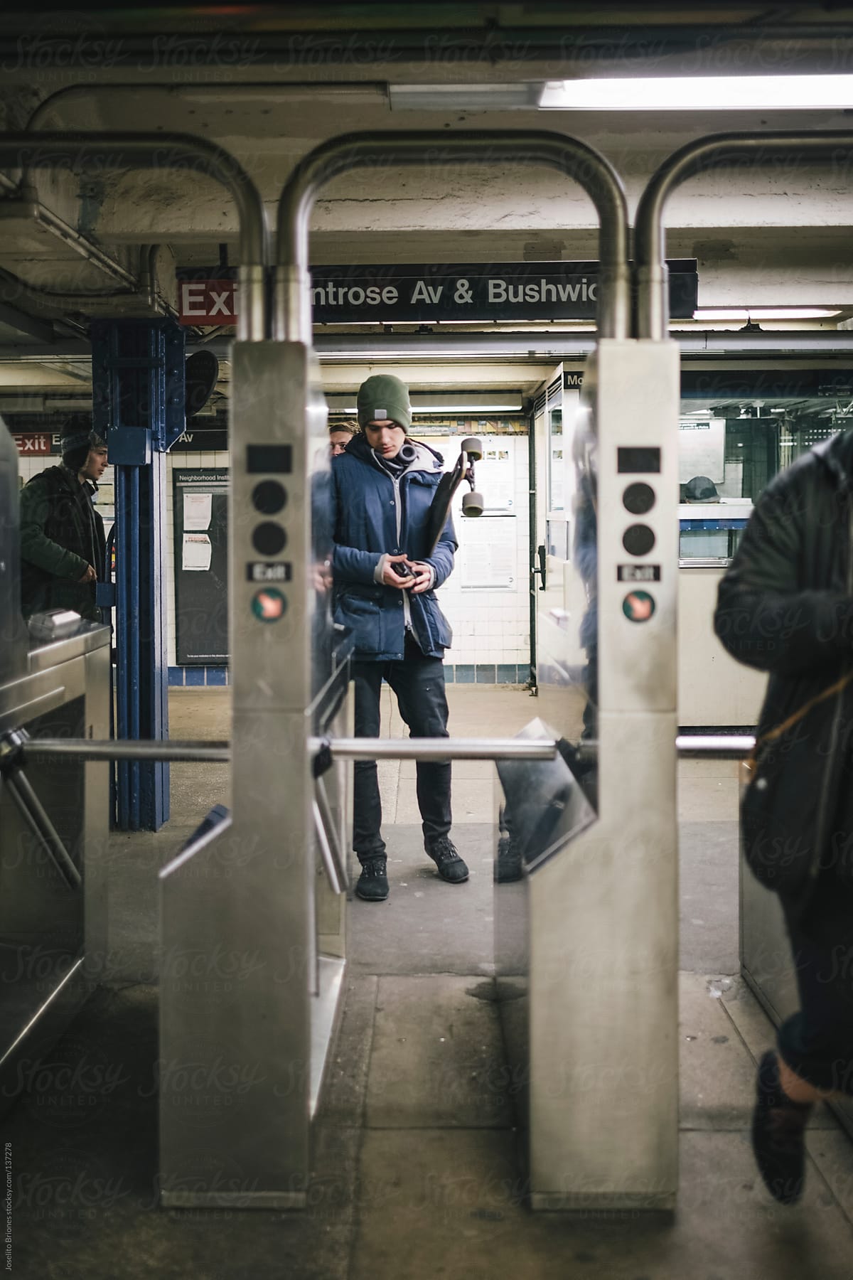 Young Male Going Through New York Subway Turnstile