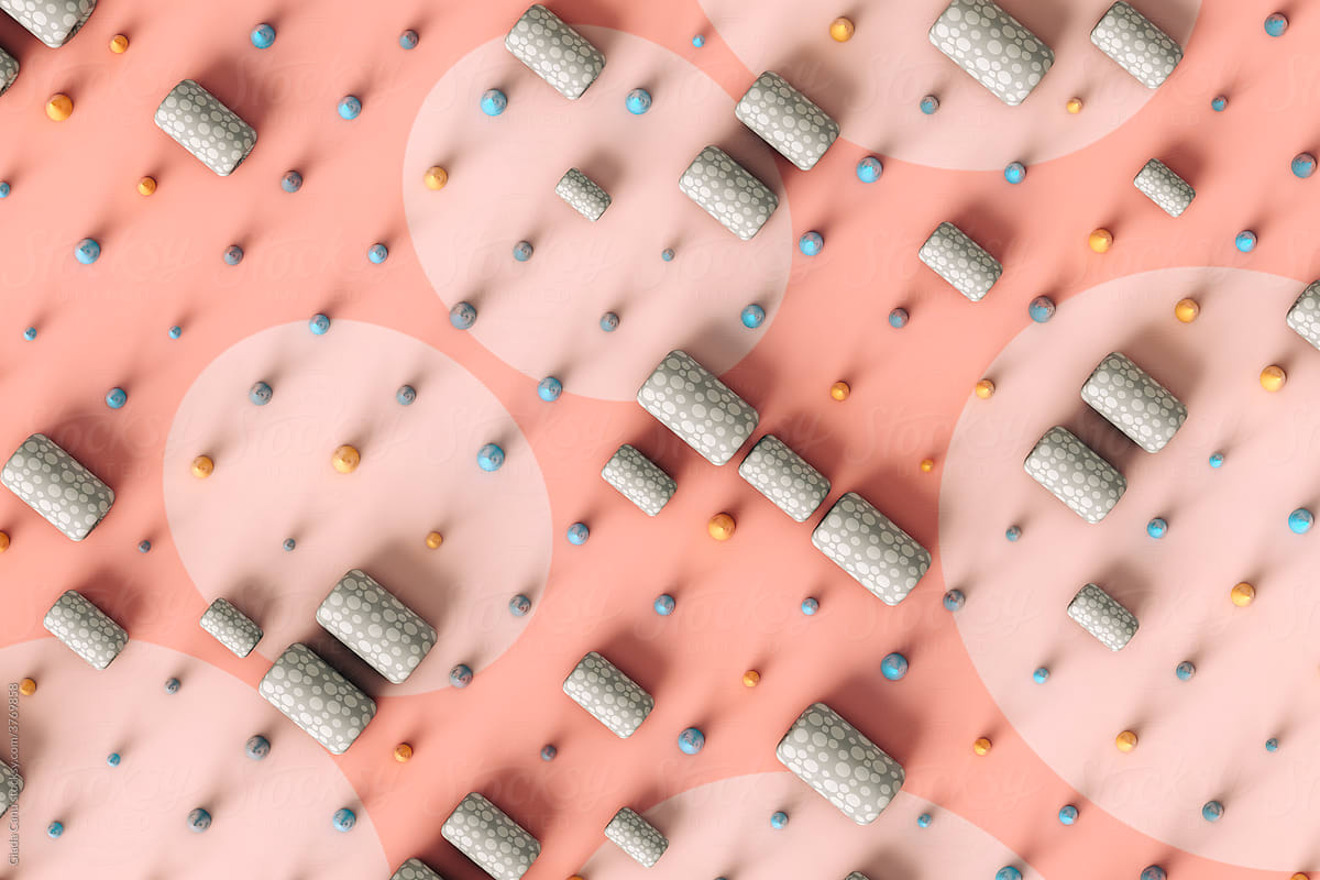 top view of Abstract cones and tubes on a pink a-pois background