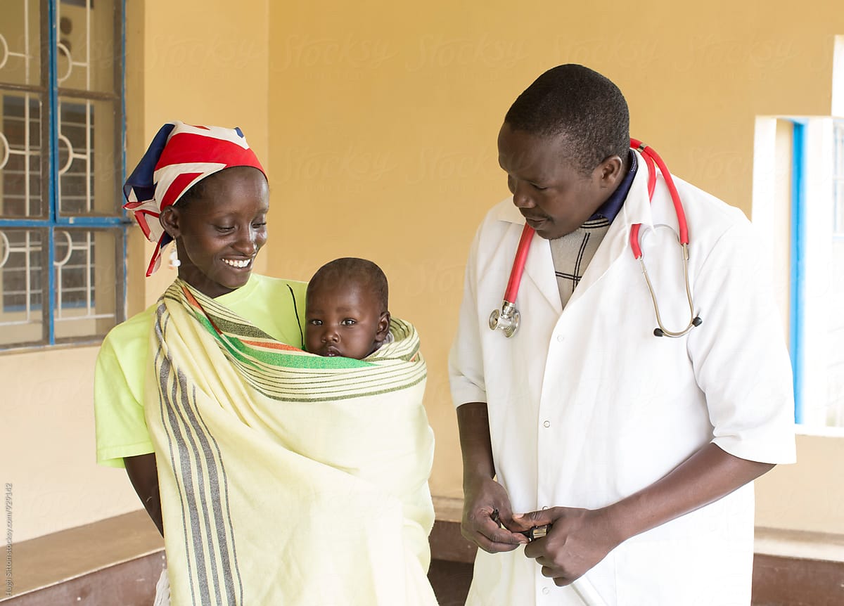 Doctor with mother and Baby. Kenya.