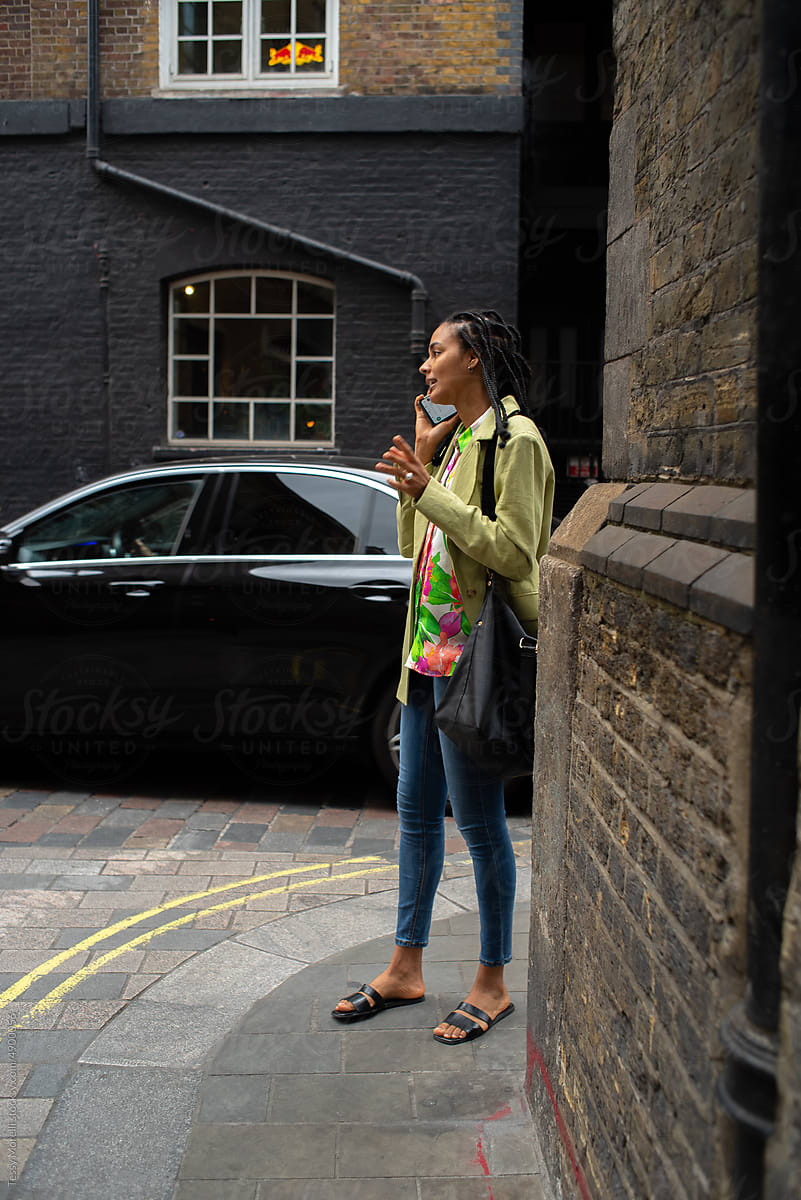 Candid street portrait businesswoman on phonecall