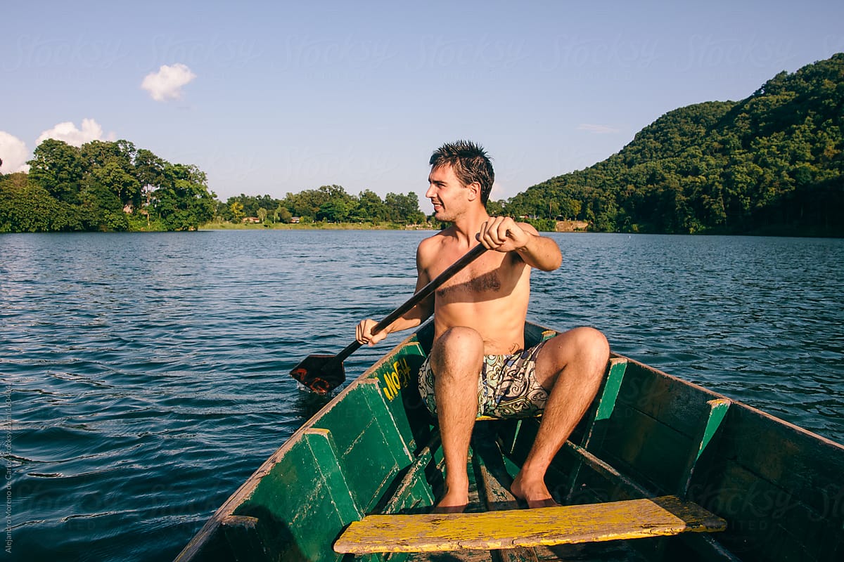 Man Rowing On A Boat On A Lake By Stocksy Contributor Alejandro Moreno De Carlos Stocksy