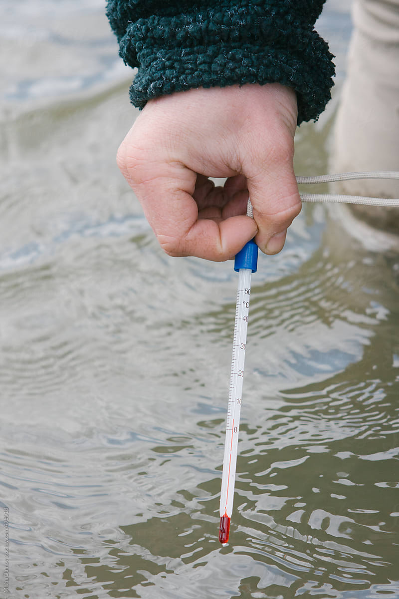 Scientist measuring water temperature