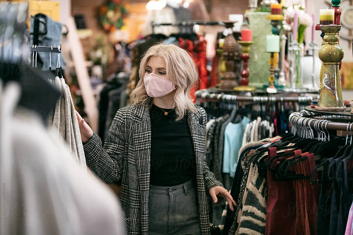 Shopping: Woman Wearing Face Mask Shops In Boutique