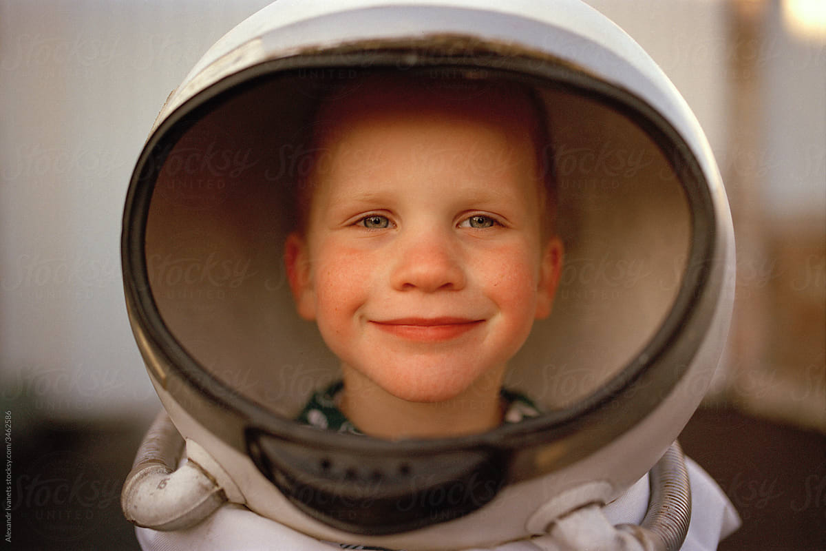 Happy boy in astronaut costume