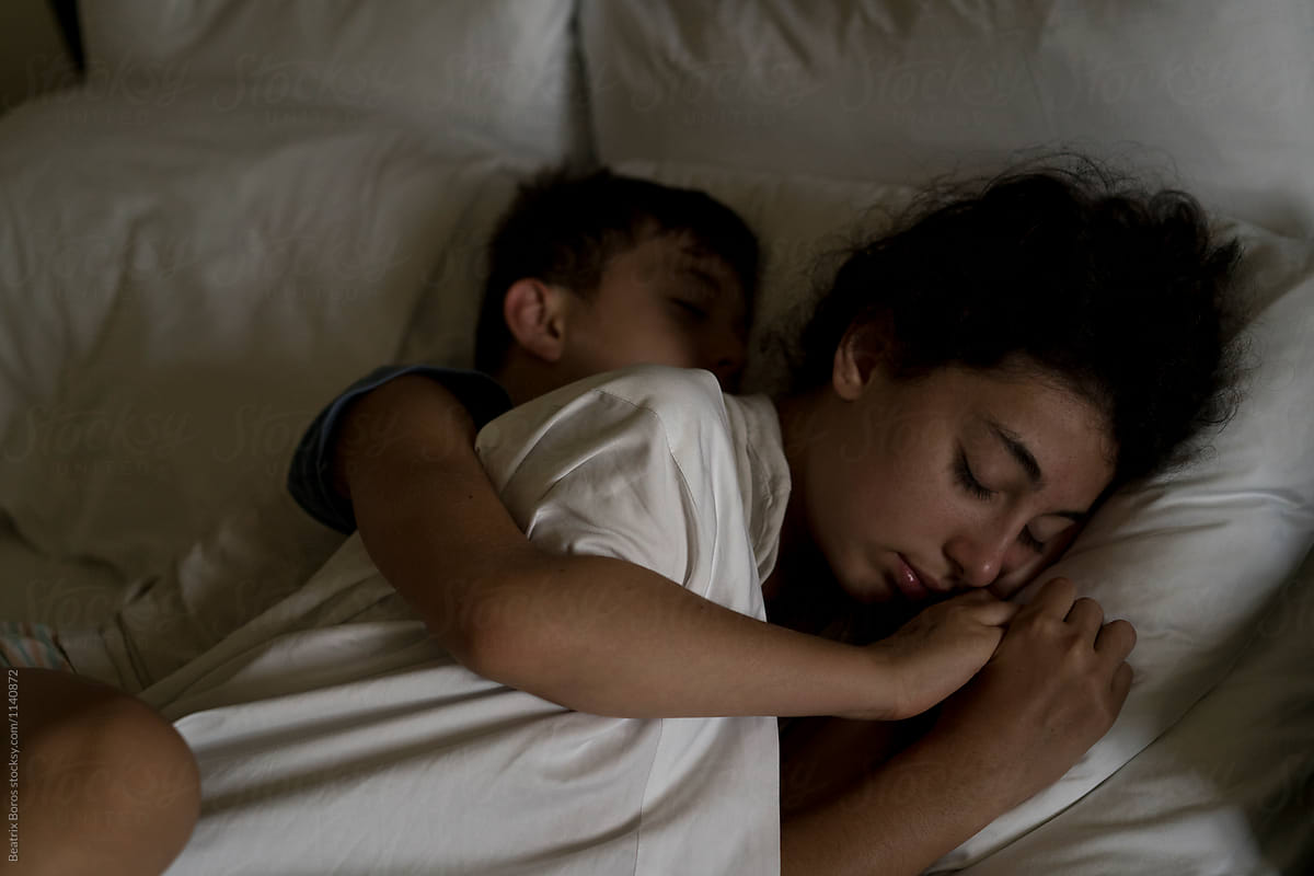 Boy Hugging His Sister While Sleeping by Beatrix Boros.