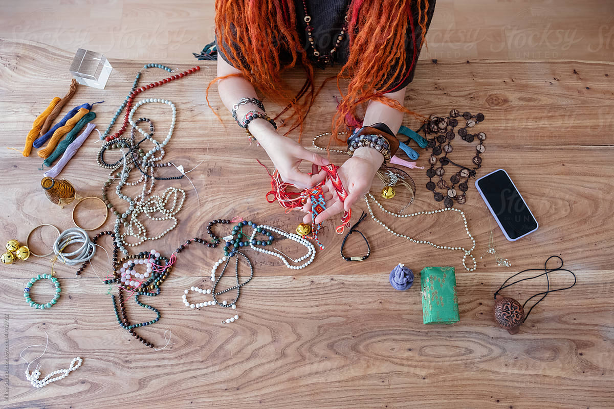 Anonymous woman checking handmade bracelets