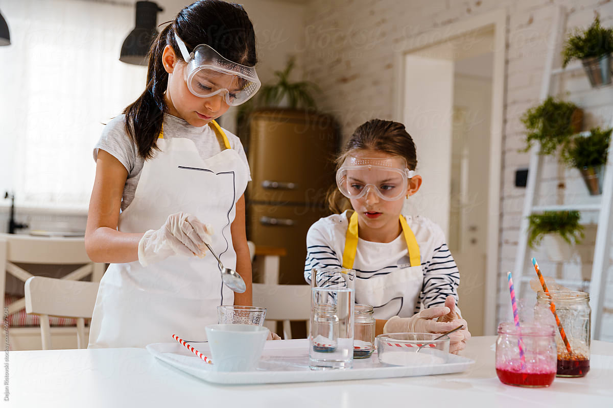 Children doing homemade experiments with kitchen food supplies