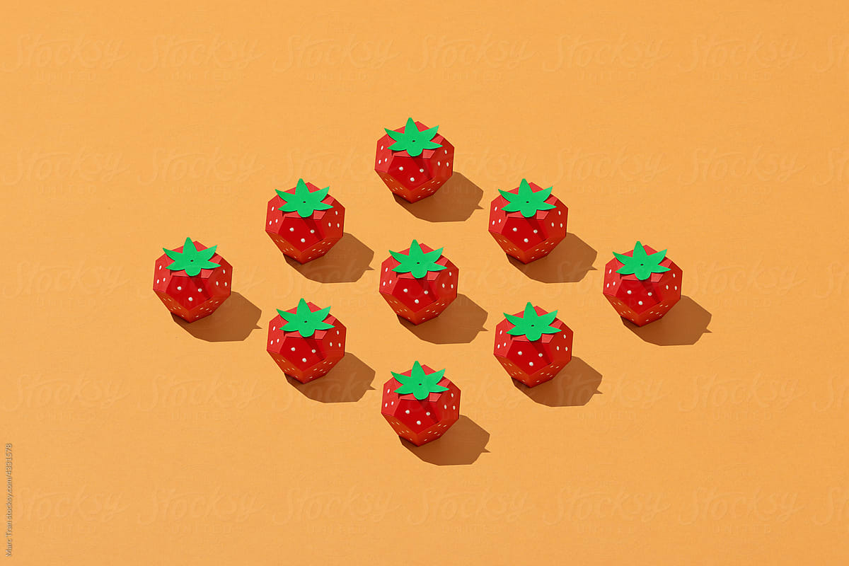 Pattern of strawberries isolated on yellow background