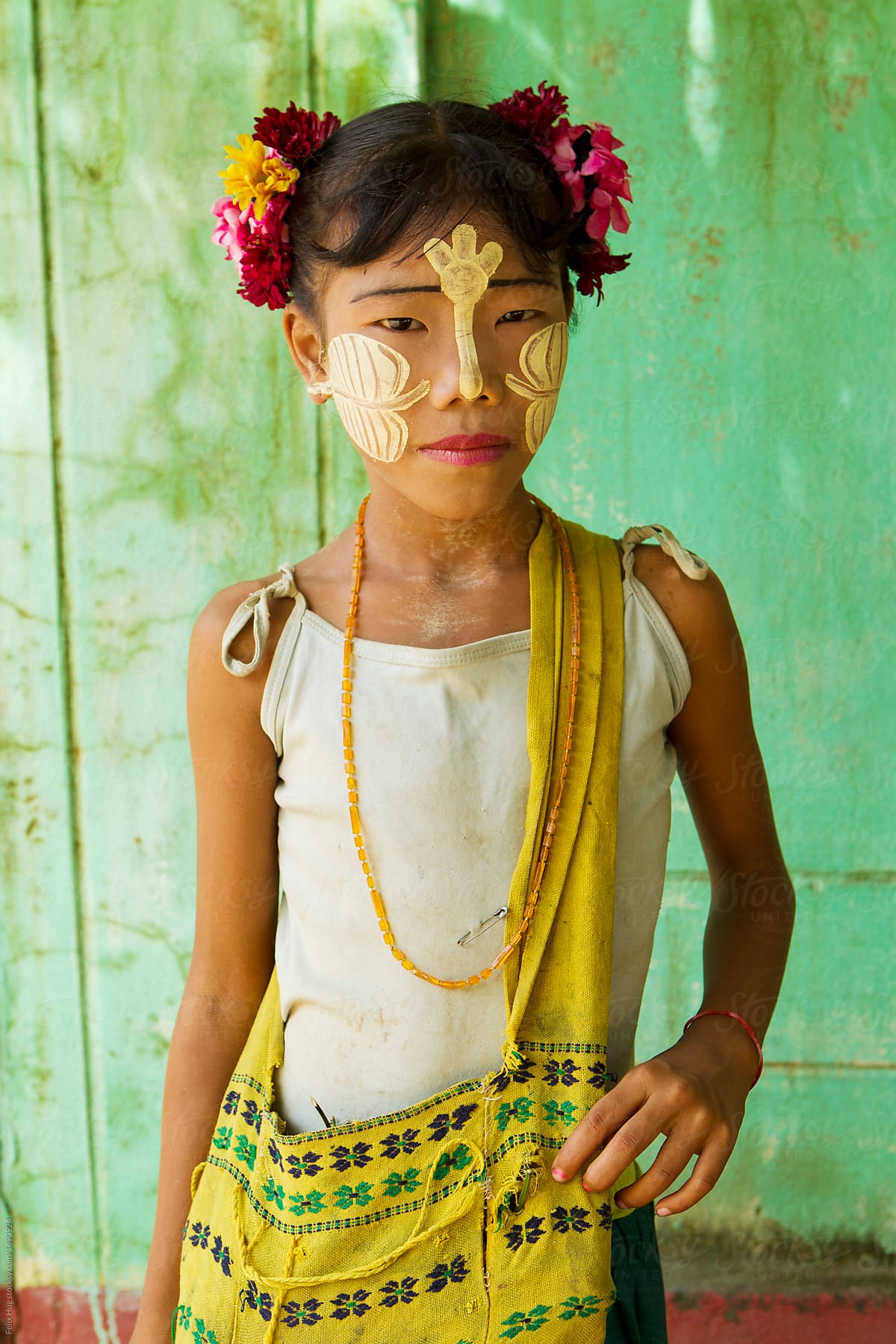 Young burmese girl with Tanaka on her face