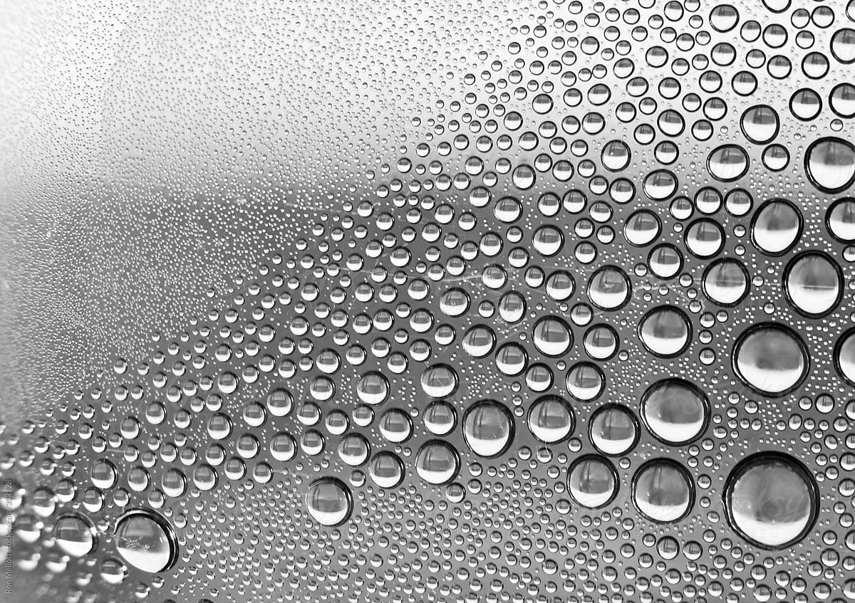 Closeup microphotograph of water droplets condensed inside a plastic bottle