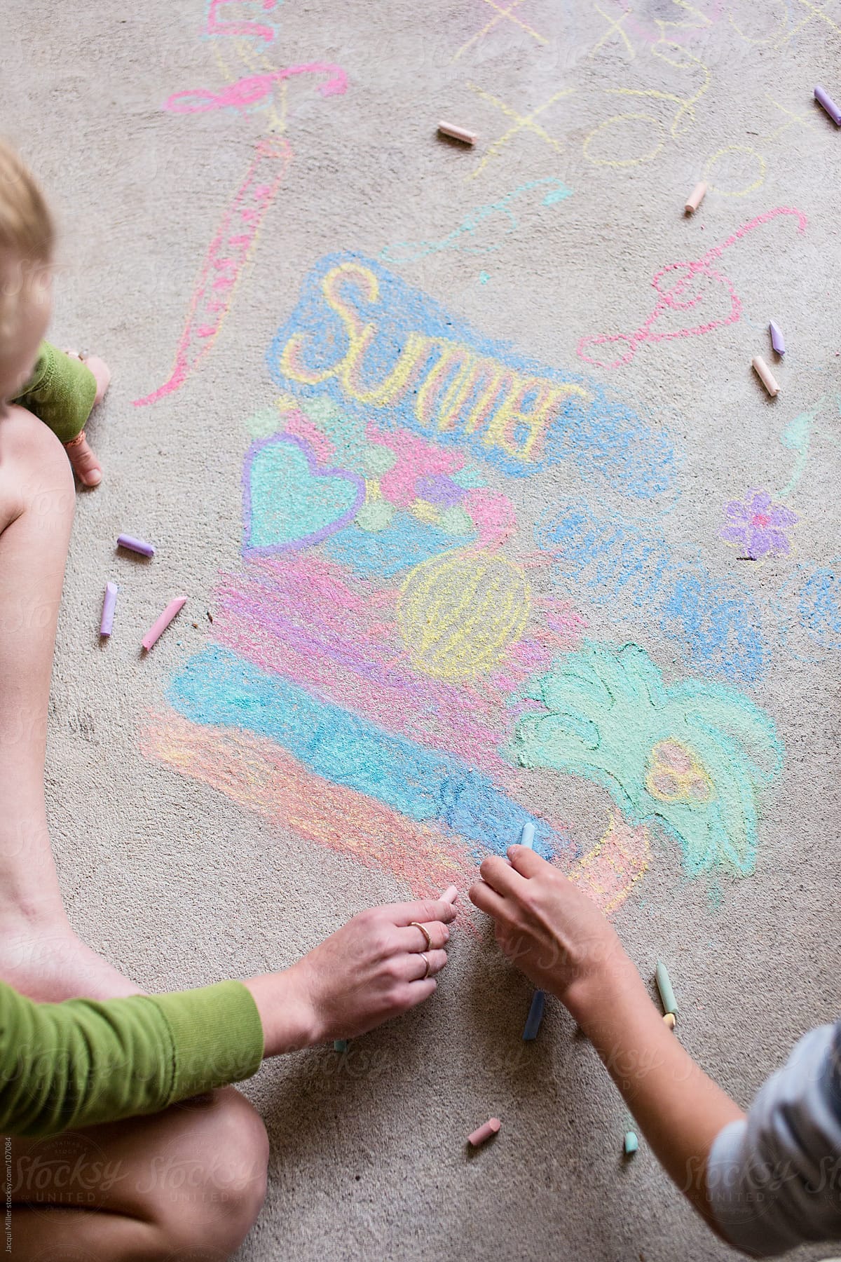 Two Girls Draw With Chalk On A Concrete Floor By Stocksy Contributor Jacqui Miller Stocksy 7575