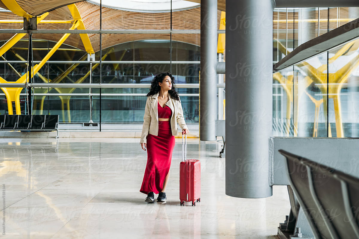 Woman with suitcase in airport