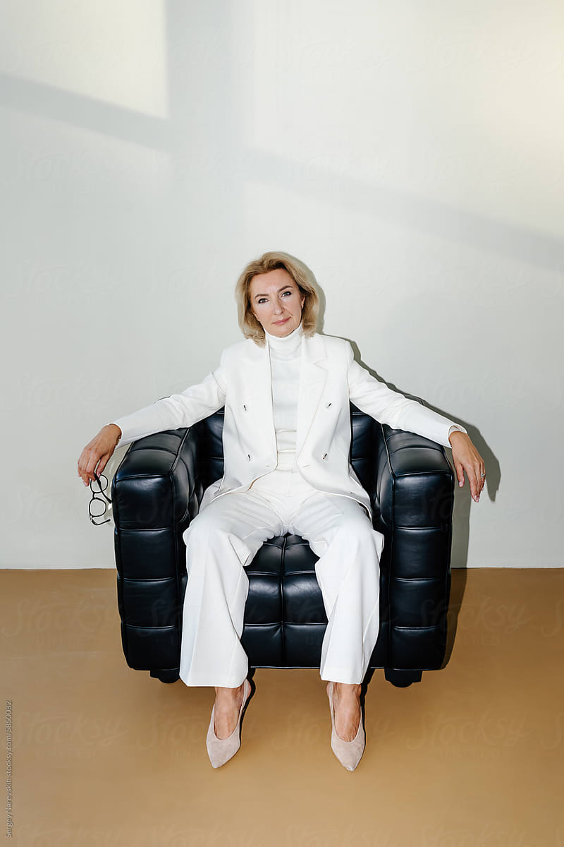 Сonfident female executive in armchair