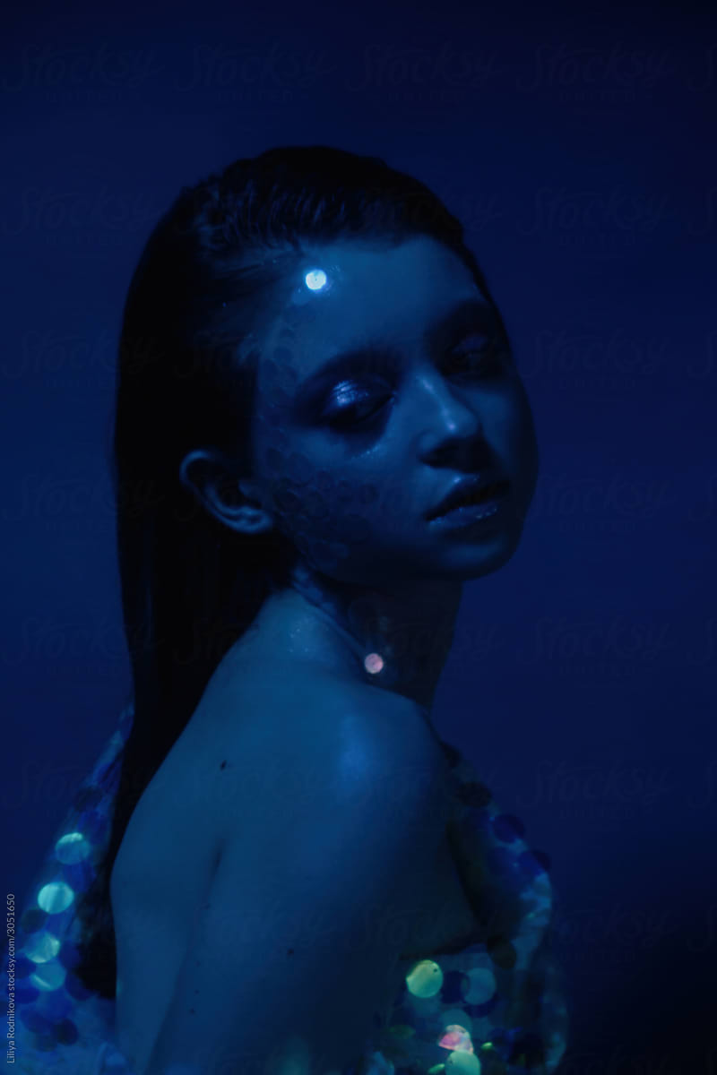 Dreamy mermaid in blue light