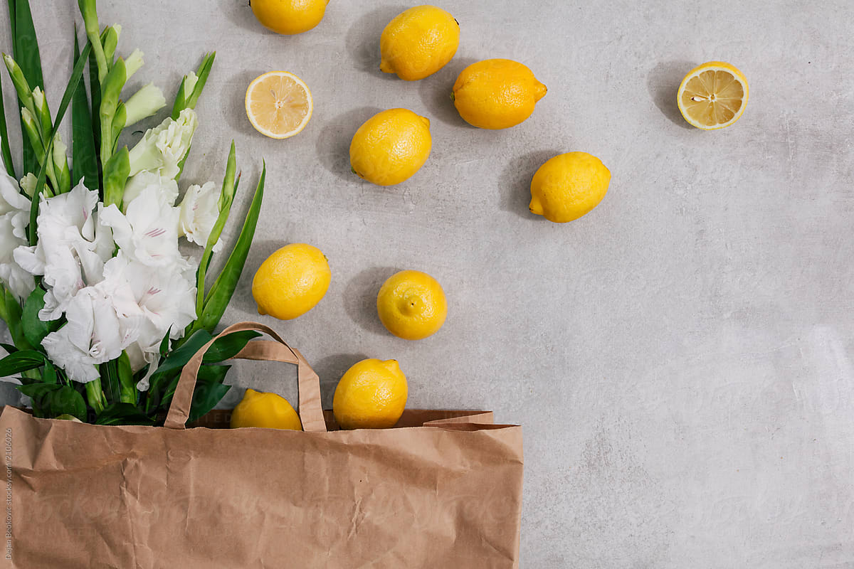 Paper bag with flower and fresh lemon