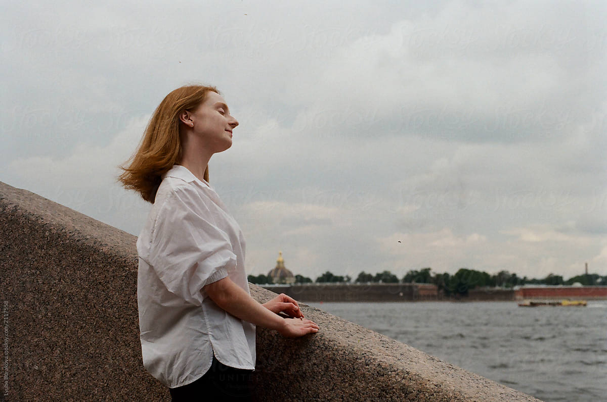 Redhead Girl Enjoys River View By Stocksy Contributor Amor Burakova Stocksy 2337