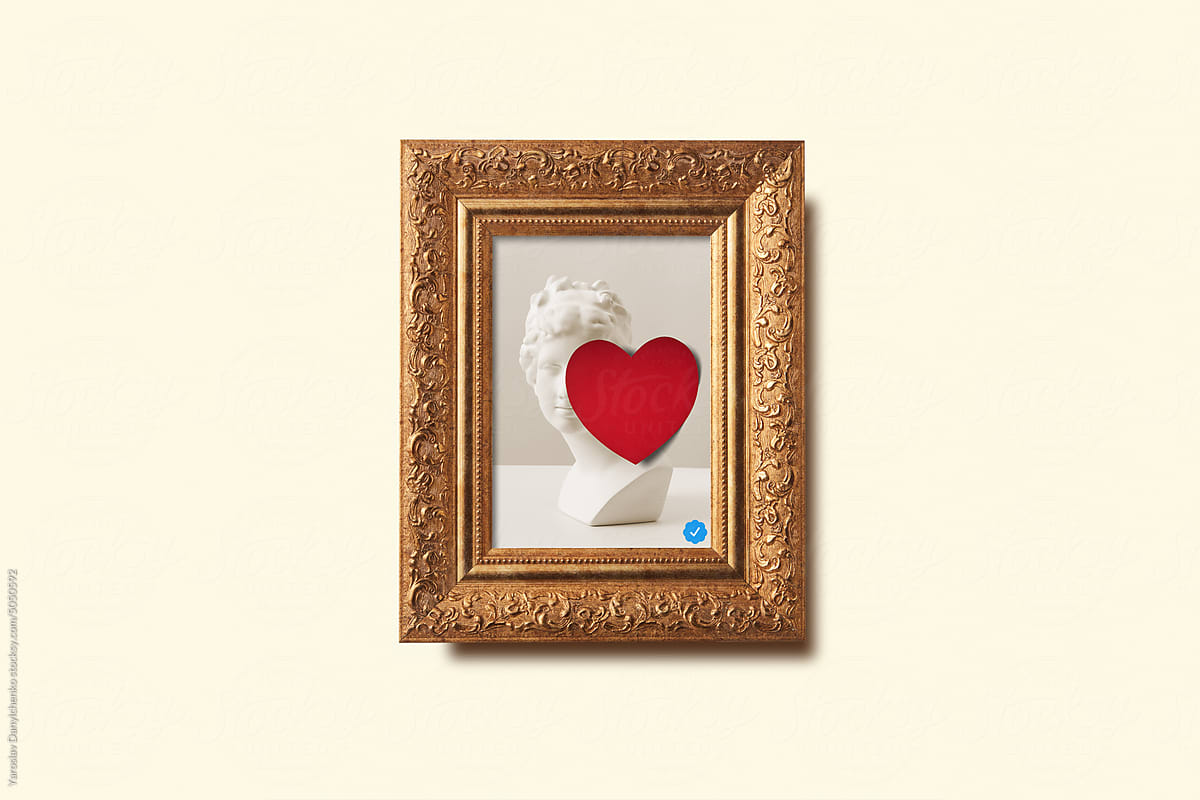Framed picture with red heart and check mark.