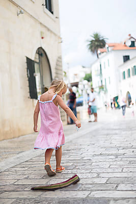 Cute Girl Walking on the Street from front view, Kid Summer