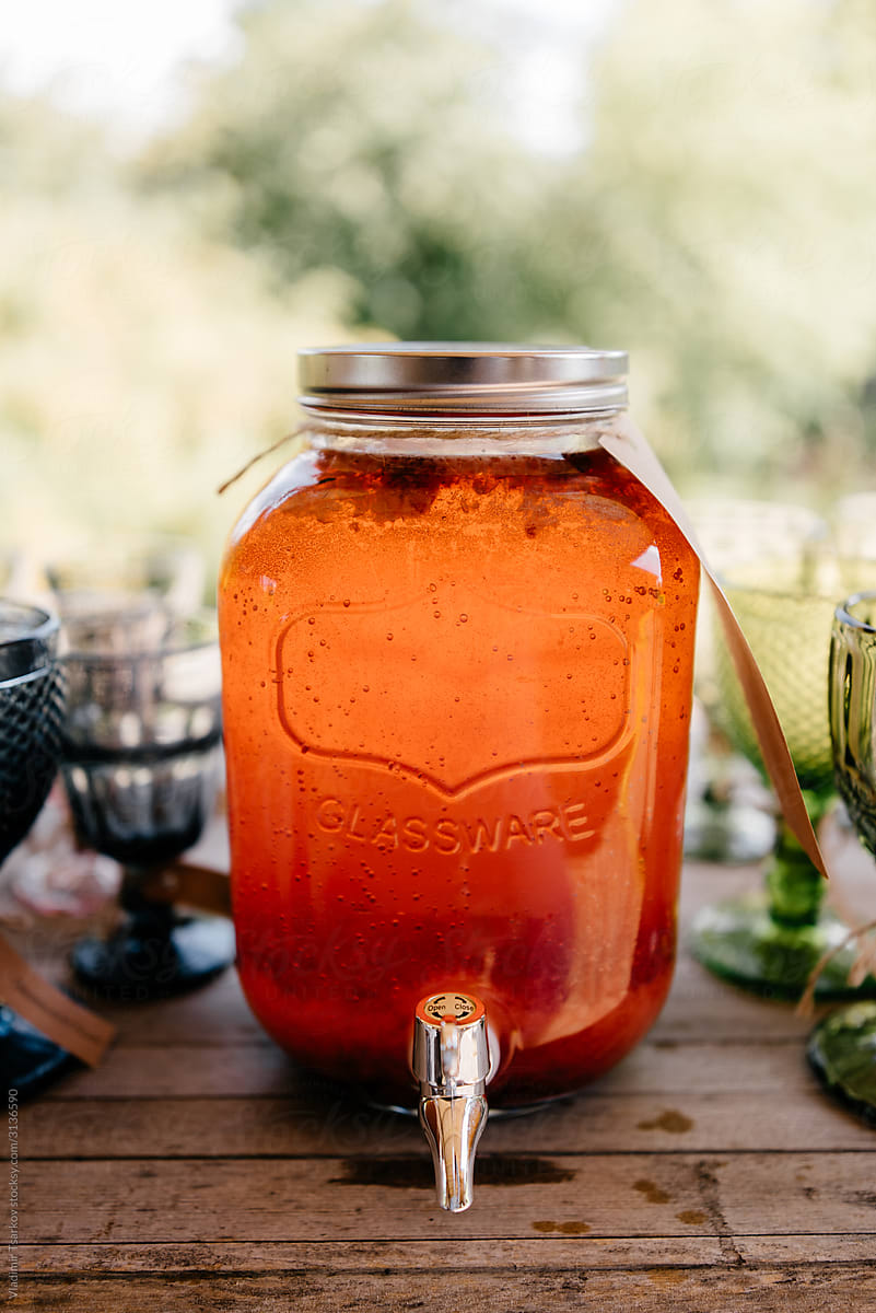 refreshing homemade lemonade in glass jar with dispenser