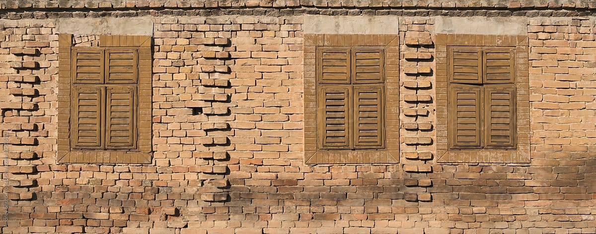 Facade detail of old rustic village house.