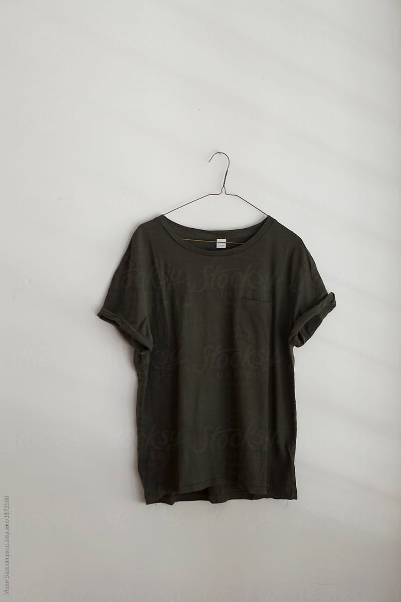 Plain T-shirt Hanging On The Wall.