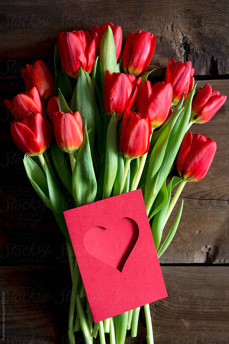 Red tulips flower bouquet with Valentine\'s card