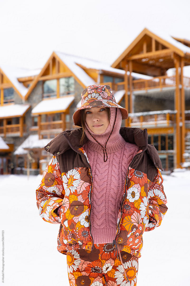 Outfit photo of a woman in the snowy mountains