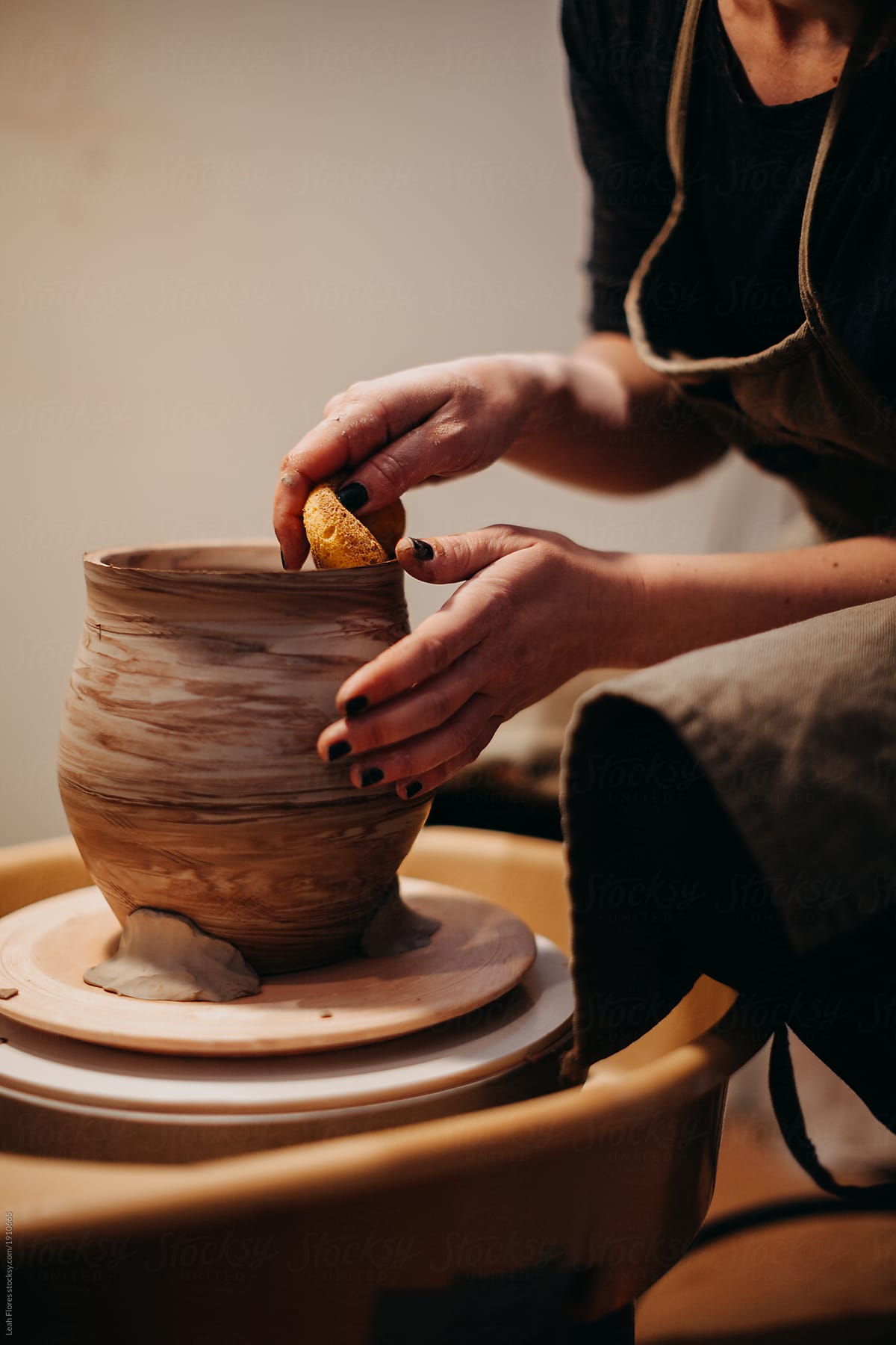 Potter Making Pots in Studio
