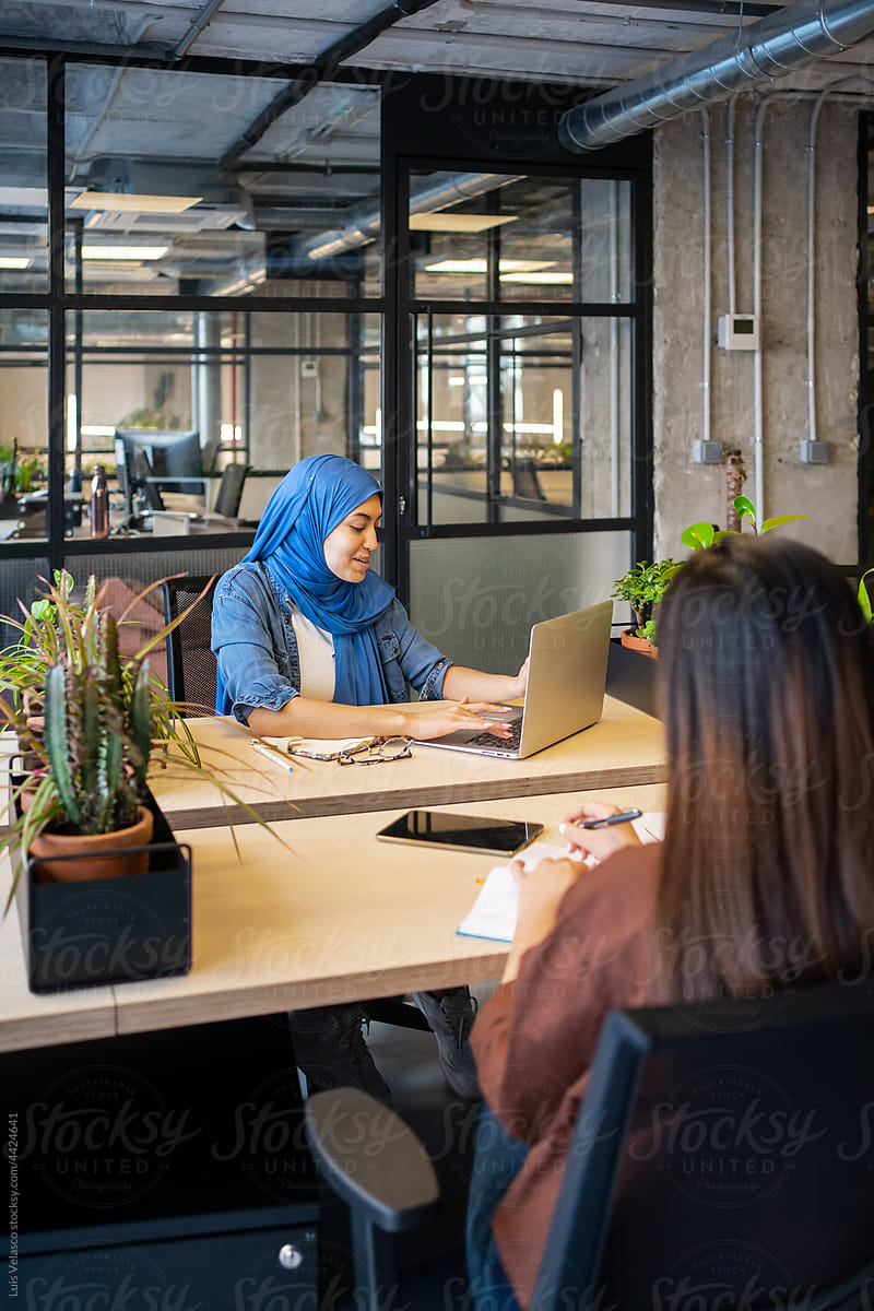 Muslim Woman Sitting Around The Table In A Co-Working.