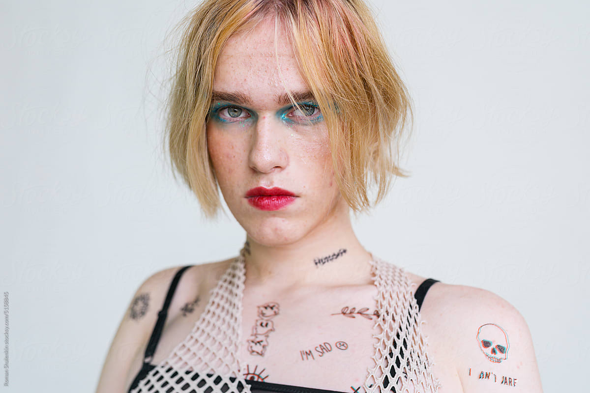 Portrait Of A Non-Binary Person With Makeup On and Acne Skin