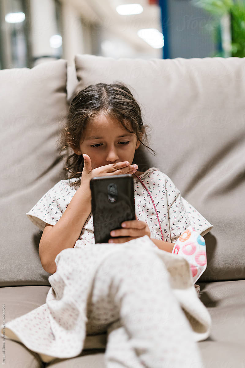 Bored girl watching video on smartphone
